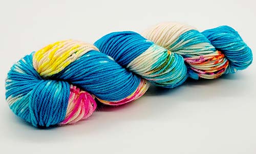 Blue, pink, yellow, and cream yarn